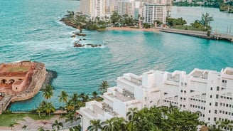 a view of a large body of water with a view of a city