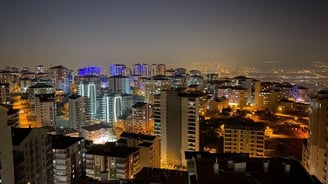 a city skyline view of a city at night