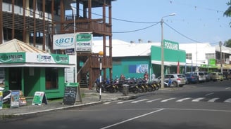 a street scene with a lot of parked motorcycles