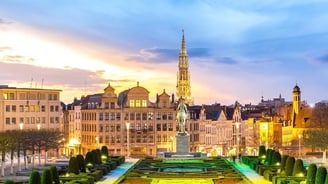 a view of a city with a clock tower in the background