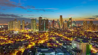 a cityscape of buildings and buildings in the evening