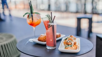 a table with two drinks and a drink