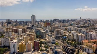 a city skyline view of a city with a view of the ocean