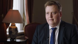 Sigmundur David Gunnlaugsson in a suit and tie sitting in the room