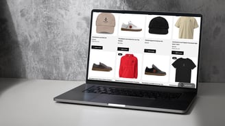 a laptop computer screen displaying YESHUA Apparel products