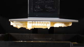 a laptop computer sitting on top of a table