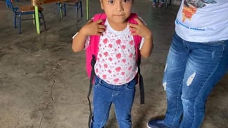 a young girl in a mask mask and a mask on her head