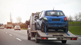 a tow truck with a flat bed