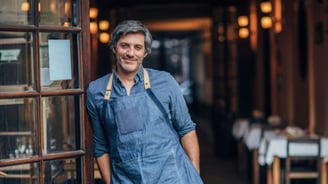 Small business owner in a blue apron and aprons