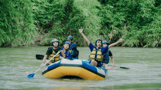 a group of people on rafting down a river