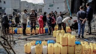 Citizens in Gaza stand in long lines to get water.