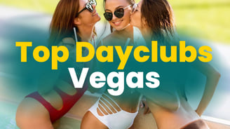 hree women in swimsuits laughing and sipping drinks in a pool, representing top Las Vegas dayclubs for unforgettable daytime 