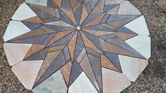 Garden feature Indian sandstone mosaic being cut for a project in martham, norfolk