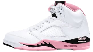 a pair of white and pink air jordans