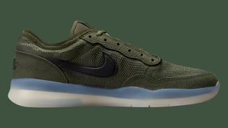 a  pair green sneaker, Nike SB PS8 