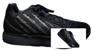 a pair of black and white sneakers with a black and white shoelacee