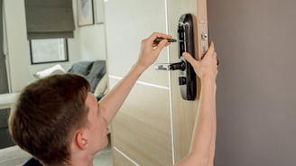 fastrepairs.ae technicians fixing a smart home lock