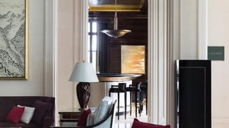 Curated painting by Lumai Studio echoing the tone and materiality of The Woodward Geneva bar