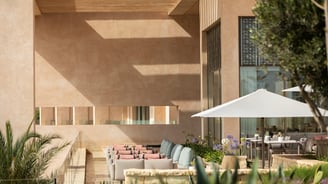 Interior of Fairmont Taghazout Bay featuring large-scale mural commissioned from Lumai Studio