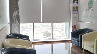 Modern blackout roller blind fully extended blocking out sunlight for complete privacy 