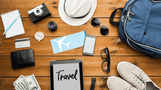 a tablet and many travel essentials