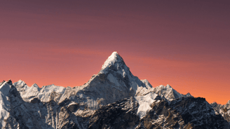 Himalayas mountain range with a pink sky