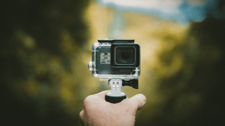a person holding a camera and taking a picture