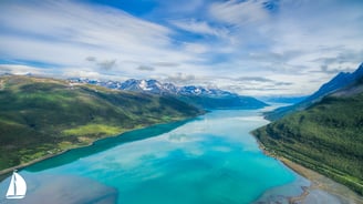 a view of a lake and mountains in the distance from Norwegian Fjords