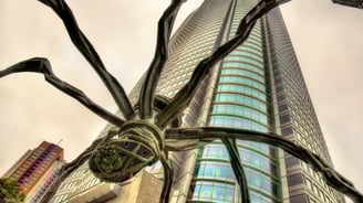 a spider art in front of a building