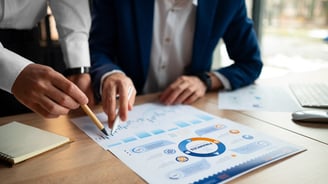 a man and woman working on a business meeting