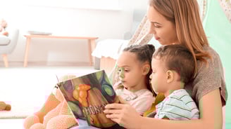 Mother reading to her children
