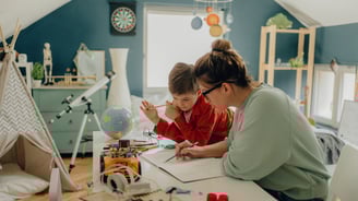 Mom helping child with homeschooling