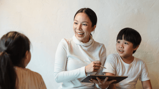 mother working with children on project
