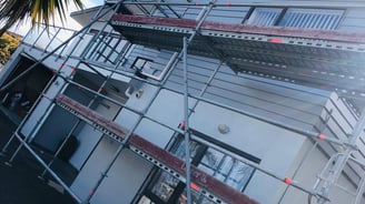 a house with scaffiered scaffolding on the roof