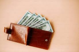 A wallet with money fanned out