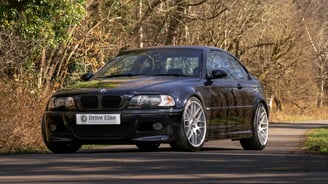 classic BMW M3 in the forest