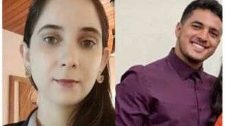 a man and woman smiling and posing for a photo