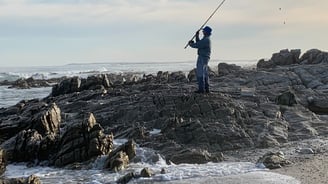 Lone fisherman on the east coast of southern africa