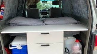 a explore africa camper van with a bed