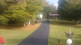 Newly paved road in West Virginia by All State Paving – expert asphalt installation.