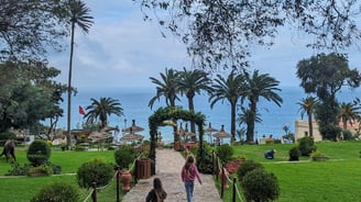 a woman walking down a path with a child