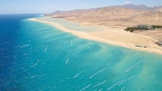 beach dakhla morocco with a view of a beach and mountains