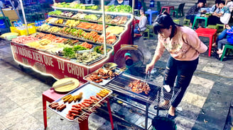 a street vendor is cooking food on a grill