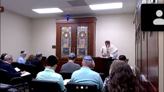 Rabbi Rudnick leading services