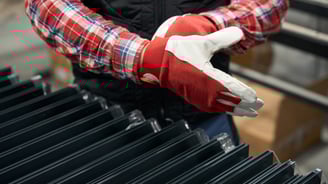 a person wearing gloves and gloves holding a glove