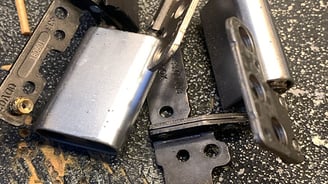 a couple of keys on a table with a knife and a knife