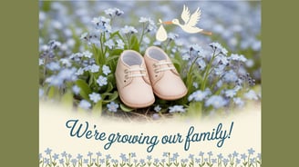 a pair of baby shoes with a stork