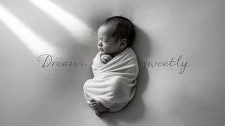a baby sleeping in a blanket wrapped in a blanket