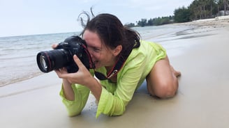 woman photographer on the beach of Koh Samui
