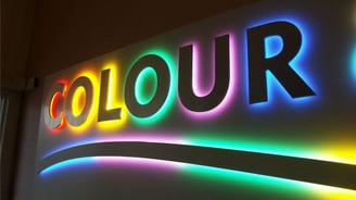 a sign that says colour in the middle of the sign